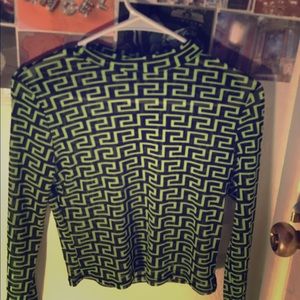 A green see through long sleeve shirt